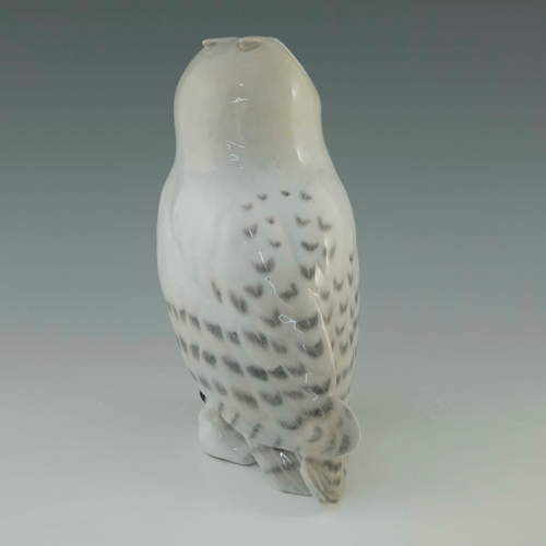 649 - A Royal Copenhagen model of a snowy owl with rabbit, 23cm high