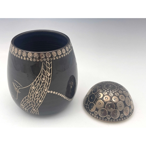 665 - Sally Tuffin for Dennis China Works, a Fulani silver lustre head shape pot, ovoid form,2007, marked ... 