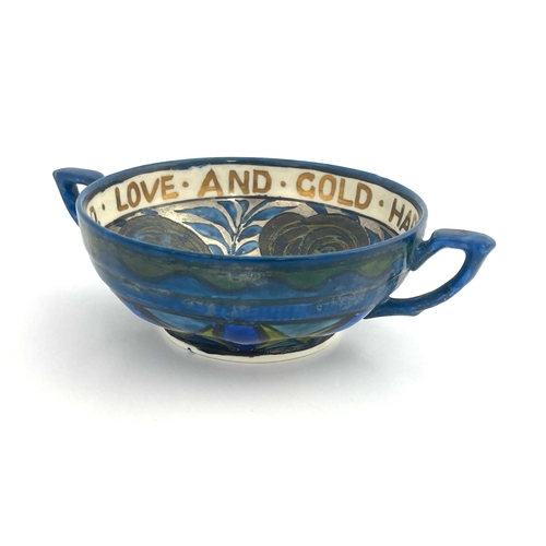 699 - John Pearson, an Arts and Crafts lustre twin handled motto bowl, the interior painted with rosettes ... 