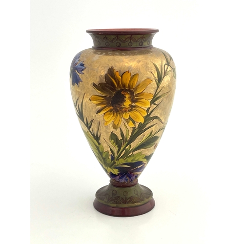 711 - A Doulton Lambeth faience lustre vase, footed inverse baluster form, painted with daisies and cornfl... 