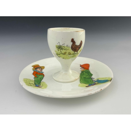 718 - Kate Greenaway for Collingwood, a nursery egg cup and integrated stand, circa 1890s, transfer printe... 