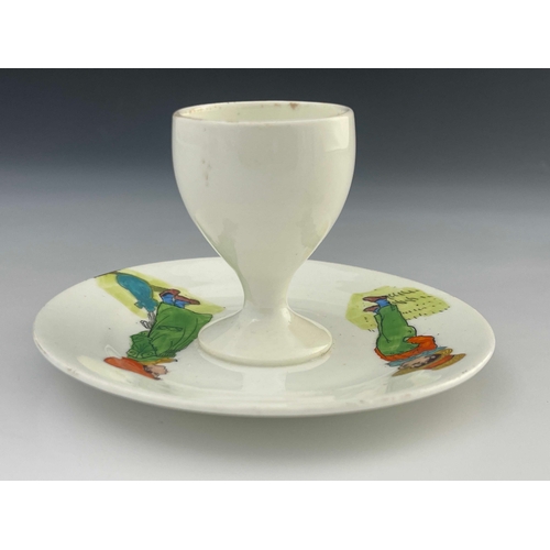 718 - Kate Greenaway for Collingwood, a nursery egg cup and integrated stand, circa 1890s, transfer printe... 