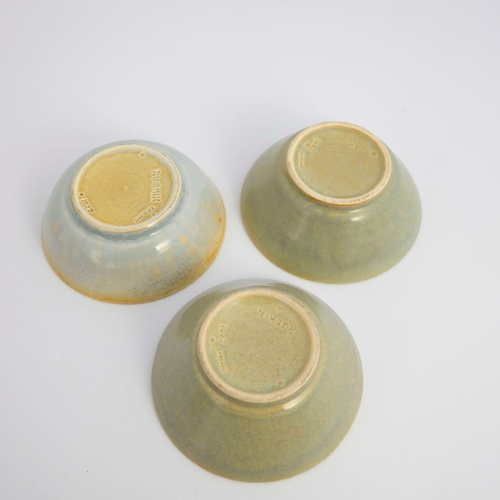 722 - Ruskin Pottery, three crystalline bowls, 1927, conical and rounded forms, green grey glazed, impress... 