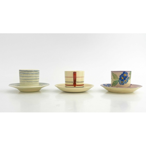 740 - Susie Cooper, three Art Deco and Gray's Pottery coffee cans and saucers, including concentric ring e... 