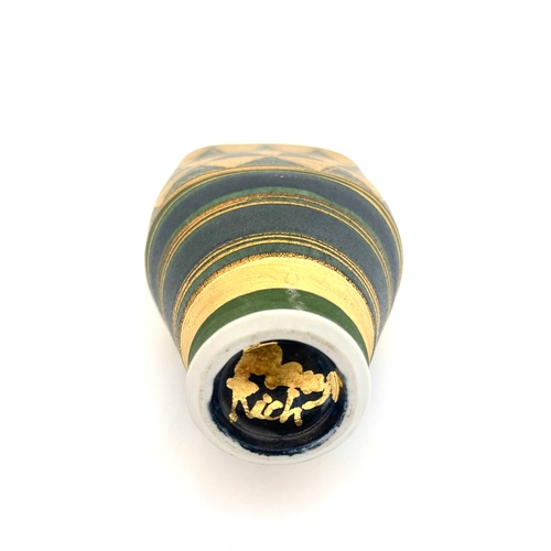 745 - Mary Rich, a studio pottery vase, flattened conical form, painted with bands of gilt ground chevrons... 