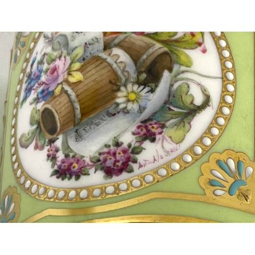 753 - Stefan Nowacki for Lynton, a floral painted coffee can and saucer, cylindrical form, painted with a ... 