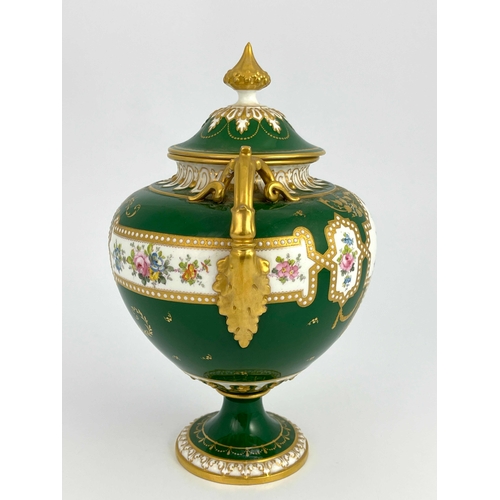 765 - C Harris for Royal Crown Derby, a twin handled pedestal vase and cover, urn form painted with exotic... 