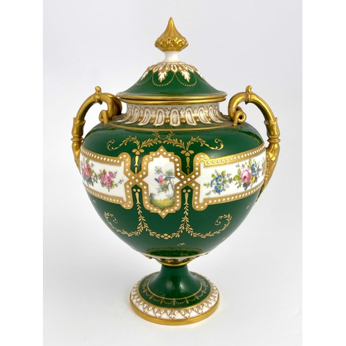 765 - C Harris for Royal Crown Derby, a twin handled pedestal vase and cover, urn form painted with exotic... 