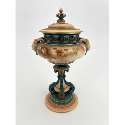 772 - A Hadleys Worcester pedestal vase and cover, modelled with twin horned mask handles, painted with mo... 