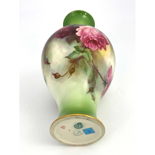 779 - M E Eaton for Royal Worcester, a rose painted vase, inverse baluster form, on green ground, 30cm hig... 