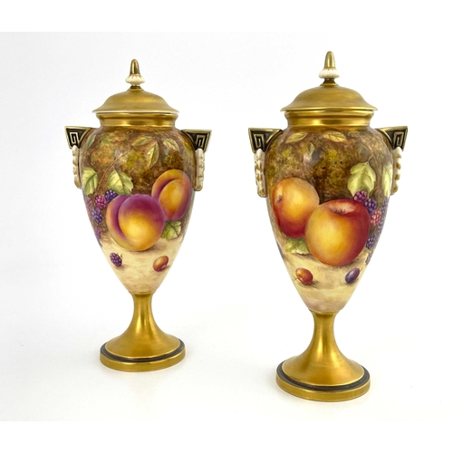 787 - S Weston for Royal Worcester, a pair of fruit painted pedestal vases and covers, ovoid footed form, ... 