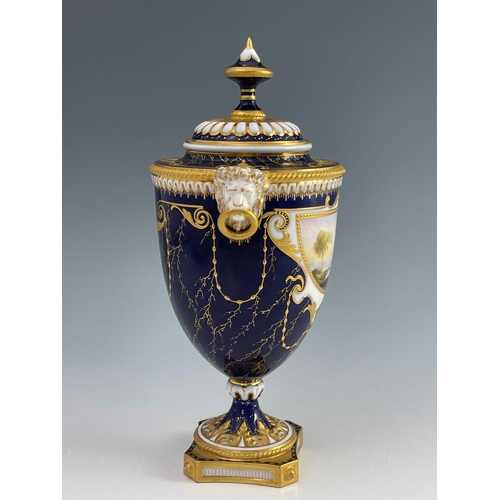 789 - Harry Davies for Royal Worcester, a landscape painted urn vase, twin handled pedestal form, the demi... 