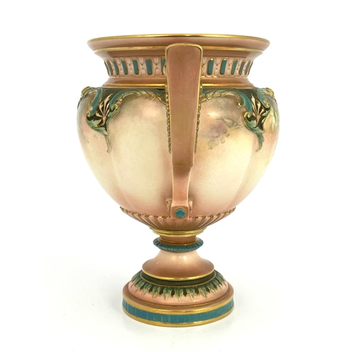 804 - A Hadleys Worcester pedestal vase, twin handled, painted with roses below relief moulded foliate bor... 