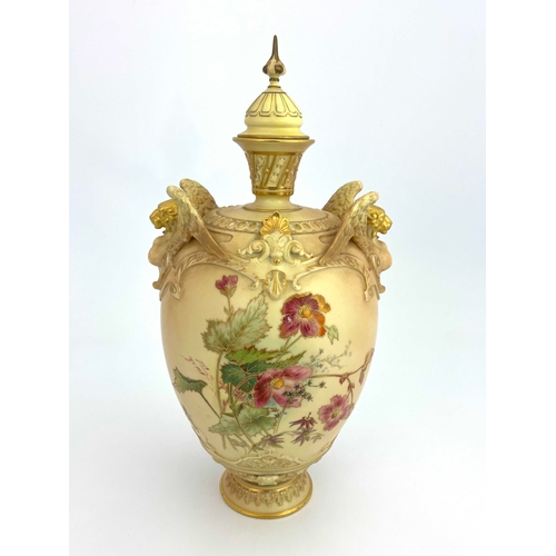 806 - A Royal Worcester blush ivory vase and cover,  ovoid form with relief moulded winged lion handles, p... 