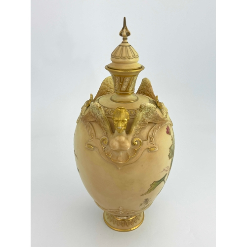 806 - A Royal Worcester blush ivory vase and cover,  ovoid form with relief moulded winged lion handles, p... 