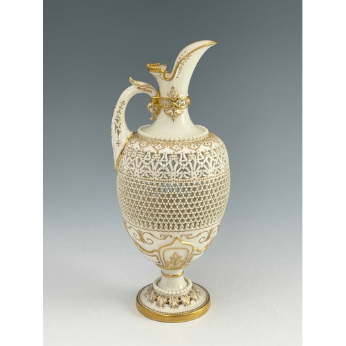 808 - George Owen for Royal Worcester, a reticulated ewer, 1919, pedestal ovoid form, pierced with hexagon... 