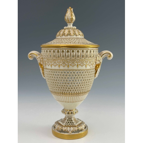 809 - George Owen for Royal Worcester, a reticulated twin handled pedestal vase and cover, 1919, urn form,... 