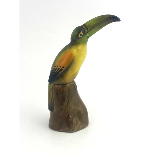 812 - A Royal Doulton figure of a toucan, HN159, modelled on a stump, 19cm high