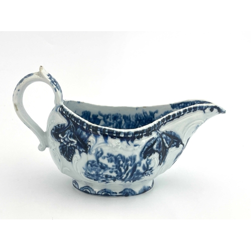 819 - An English porcelain relief moulded blue and white sauce boat, circa 1765, probably Derby, in the Ro... 