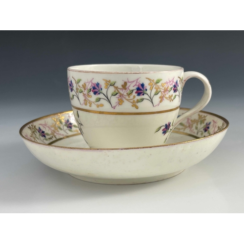 823 - A Pinxton porcelain tea cup and saucer, pattern 14, circa 1800, painted and gilded with chantilly sp... 