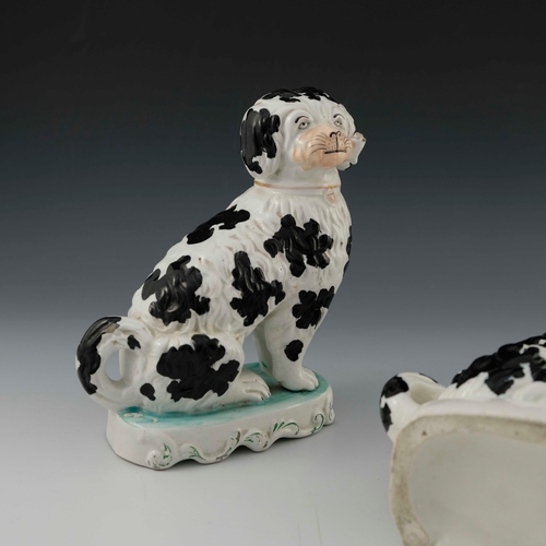 830 - A pair of Staffordshire pottery chimney spaniels, circa 1870, white with black spots and 'Disraeli' ... 