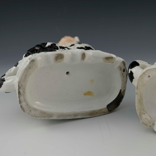 830 - A pair of Staffordshire pottery chimney spaniels, circa 1870, white with black spots and 'Disraeli' ... 