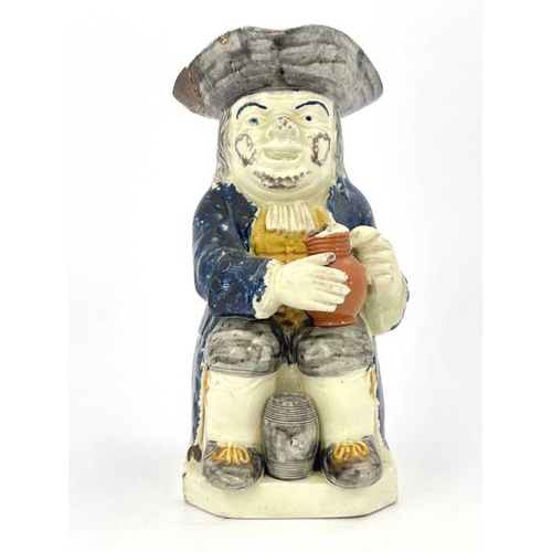 833 - A Staffordshire Prattware Toby jug, Ralph Wood mould, circa 1800, modelled sitting with a frothing j... 