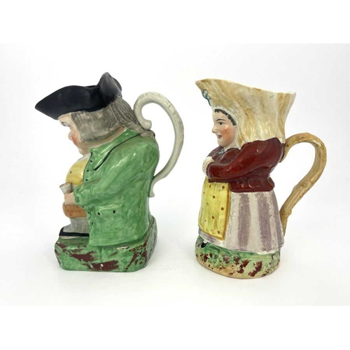 835 - Two Staffordshire Toby jugs, including Martha Gunn, modelled with hands clasped around a gin glass, ... 