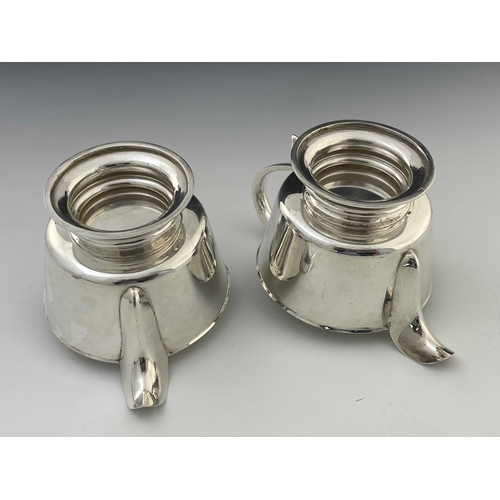 18 - A pair of Elizabeth II silver jugs, in the Charles II style, footed conical form, ear handles, 18.5m... 