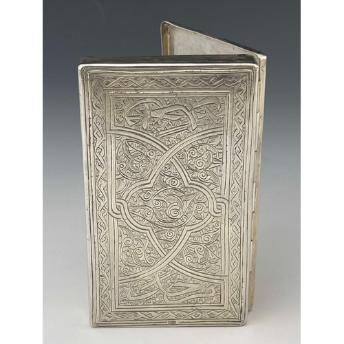 2 - An Egyptian silver box, cuboid form with hinged lid, engraved ad chased with Persian style foliate a... 