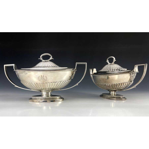 21 - A matched pair of George III silver sauce tureens and covers, Abraham Peterson and John Emes, London... 