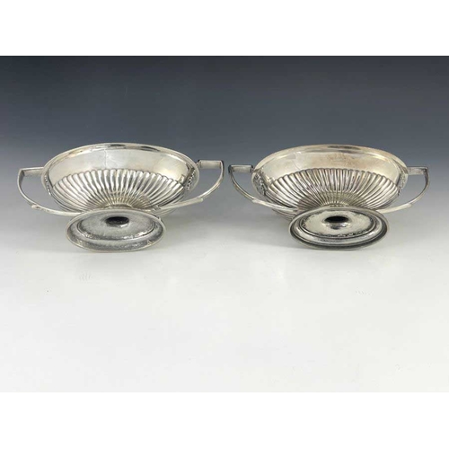 21 - A matched pair of George III silver sauce tureens and covers, Abraham Peterson and John Emes, London... 