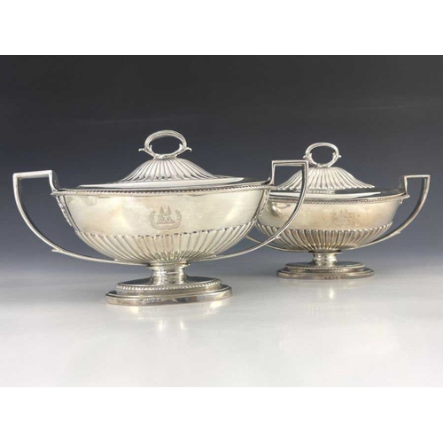 21 - A matched pair of George III silver sauce tureens and covers, Abraham Peterson and John Emes, London... 