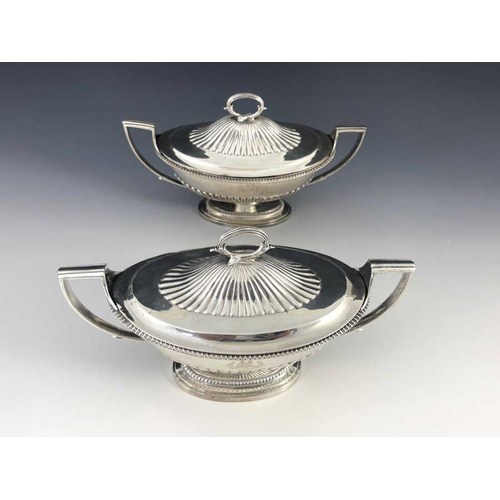 21 - A matched pair of George III silver sauce tureens and covers, Abraham Peterson and John Emes, London... 