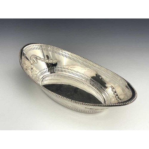 30A - A Victorian silver basket, James Dixon & Sons, London 1896, reticulated boat form, beaded and pierce... 