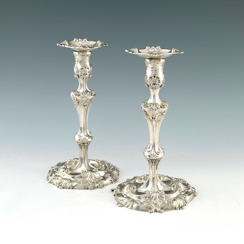 33 - A pair of George II silver candlesticks, William Skeen, London 1755, in the Rococo style, knopped ba... 