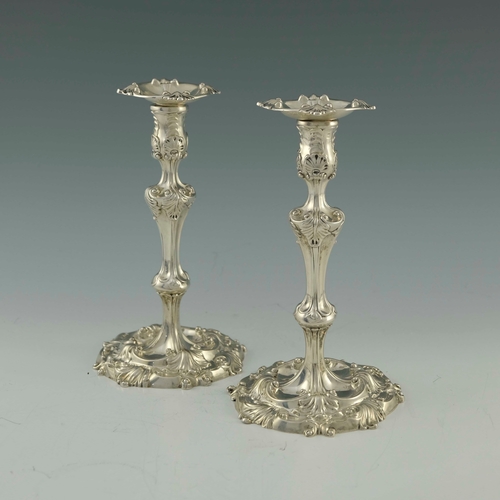 33 - A pair of George II silver candlesticks, William Skeen, London 1755, in the Rococo style, knopped ba... 