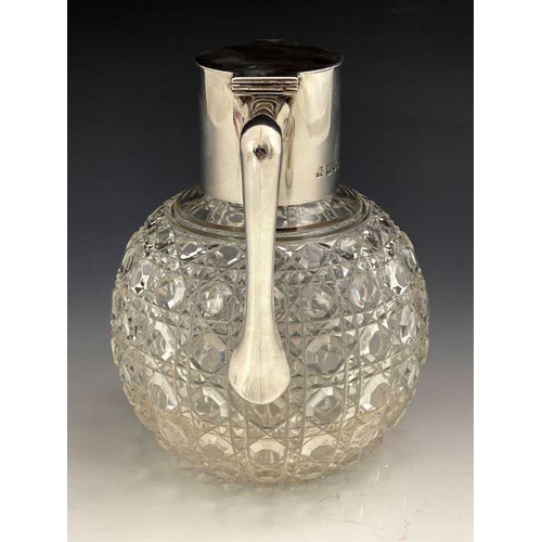 62 - After Christopher Dresser, an Aesthetic Movement silver and cut glass claret jug, Heath and Middleto... 