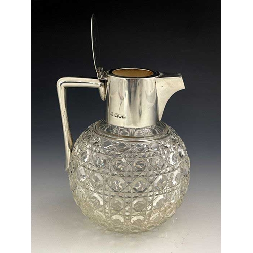 62 - After Christopher Dresser, an Aesthetic Movement silver and cut glass claret jug, Heath and Middleto... 