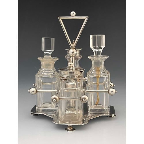 63 - Christopher Dresser for Hukin and Heath, an Arts and Crafts silver and glass cruet, Birmingham 1885,... 