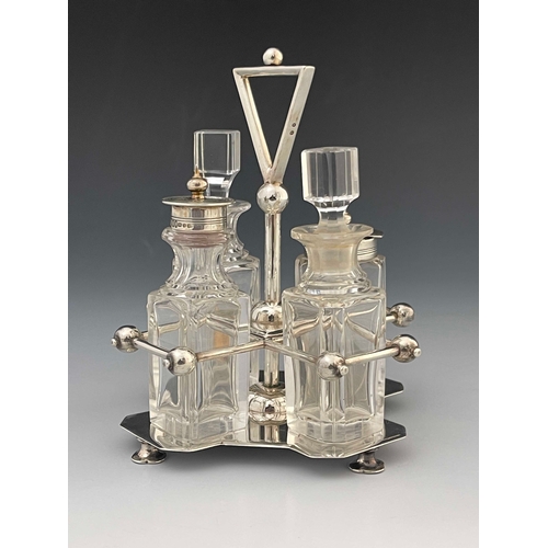 63 - Christopher Dresser for Hukin and Heath, an Arts and Crafts silver and glass cruet, Birmingham 1885,... 