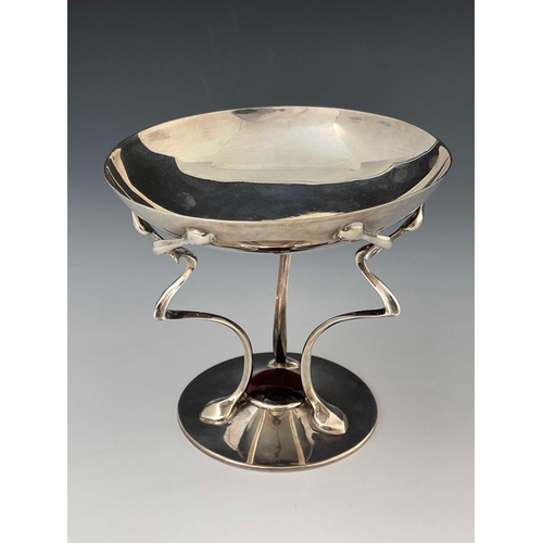 70 - An Arts and Crafts silver pedestal dish, John Round, Sheffield 1904, the shallow bowl on three whipl... 