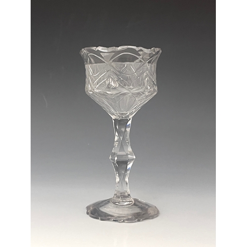 593 - A facet cut pedestal sweetmeat glass, circa 1770, the tulip bowl cut with geometric mitre decoration... 