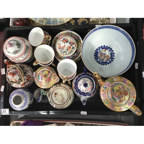 41 - A collection of Chinese and Oriental ceramics, including teapots, six tea cups and saucers, vase and... 