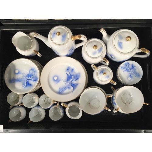 45 - A Japanese egg shell porcelain tea set, Hayasi, monochrome painted landscape scenes