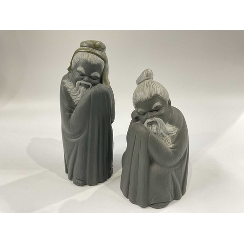 142B - Two Lladro grey stoneware figures of a standing Chinaman, and a seated Chinaman, blue printed and im... 