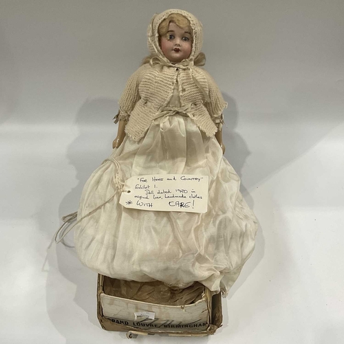 142E - An early 20th Century French bisque head doll, blonde wig, sleeping eyes, open mouth and pierced ear... 