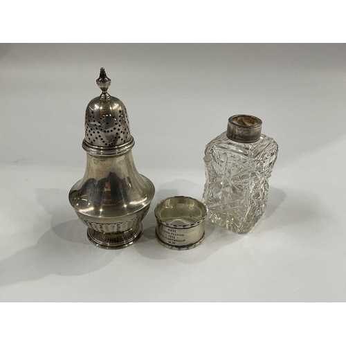 143D - A George V silver sugar sifter, baluster form with half reeded body, on circular foot 15cm high, 4.3... 