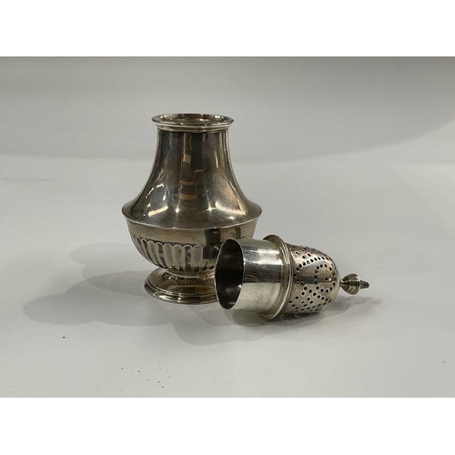 143D - A George V silver sugar sifter, baluster form with half reeded body, on circular foot 15cm high, 4.3... 