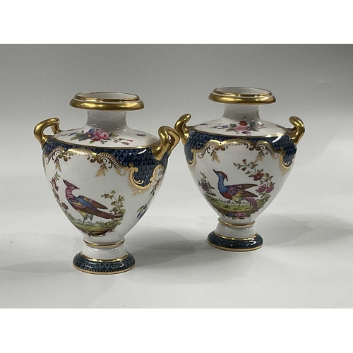 146A - A pair of Spode Copeland's China vases, twin handled inverse baluster form, printed and painted with... 